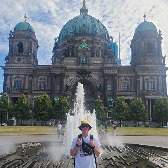 Thomas Maul stands in front of the Berlin Cathedral during an education abroad trip to Germany.