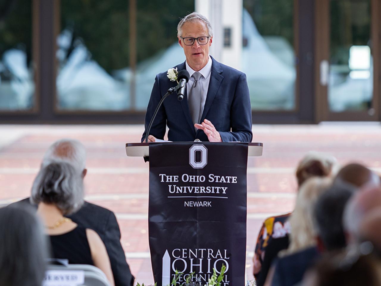 Dean Bill MacDonald address attendees at a ribbon cutting ceremony for the newly renovated Hodges Hall.