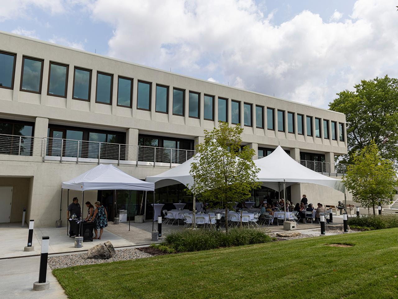 Tents are set up on the courtyard of the newly renovated Hodges Hall.