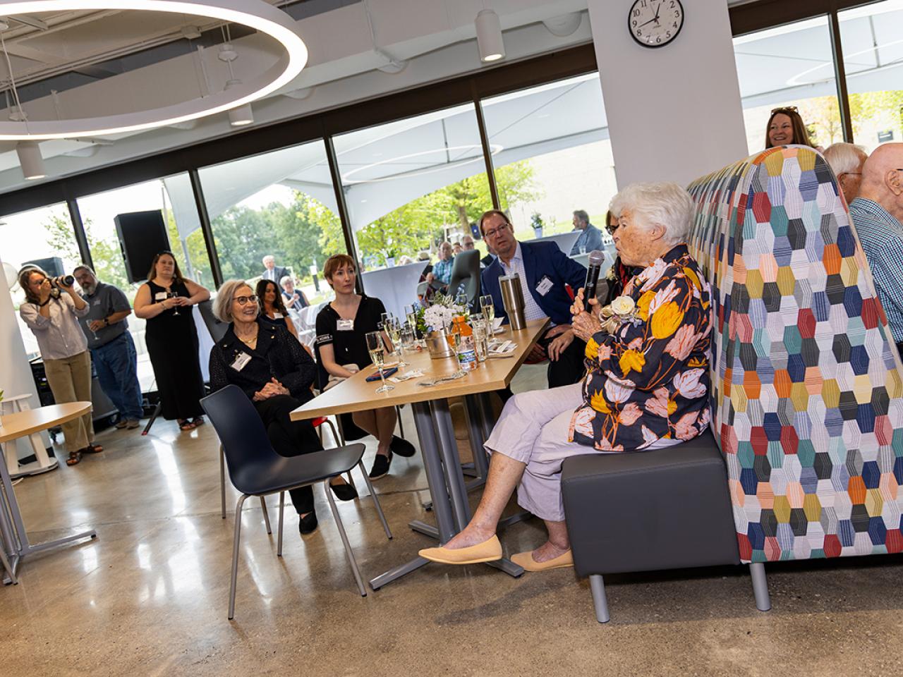 Louella Reese address guests at a reception for the grand opening of the newly renovated Hodges Hall.