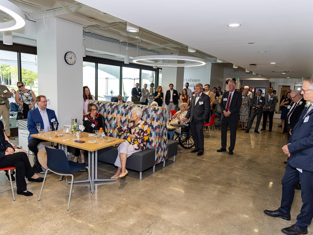 Louella Reese address guests at a reception for the grand opening of the newly renovated Hodges Hall.