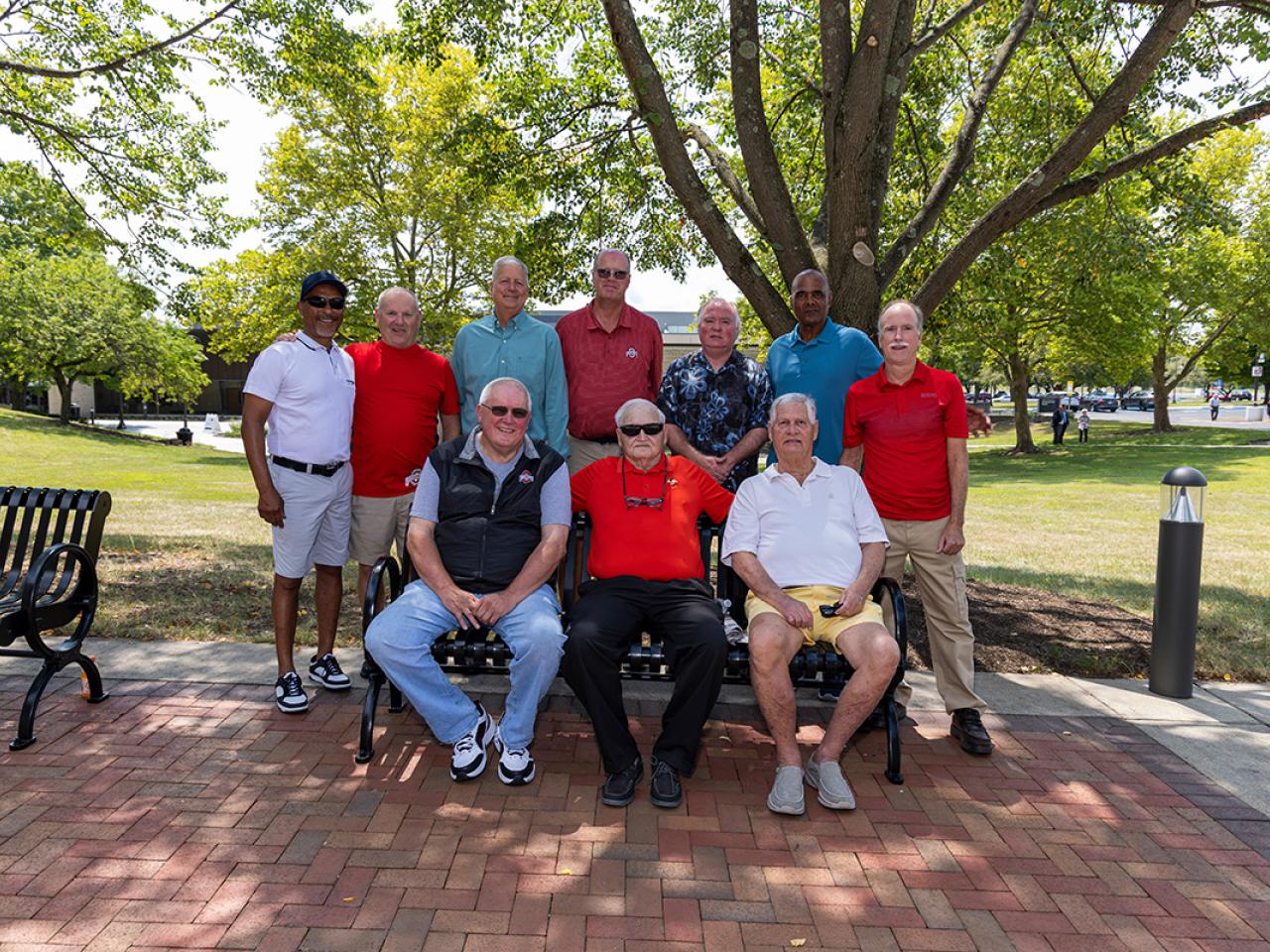 Portrait of Coach Greg Wince and members of the Newark Titans Championship Basketball Team who are pictured on the history wall inside Louella Hodges Reese Hall at the ribbon cutting ceremony of the newly renovated Hodges Hall.