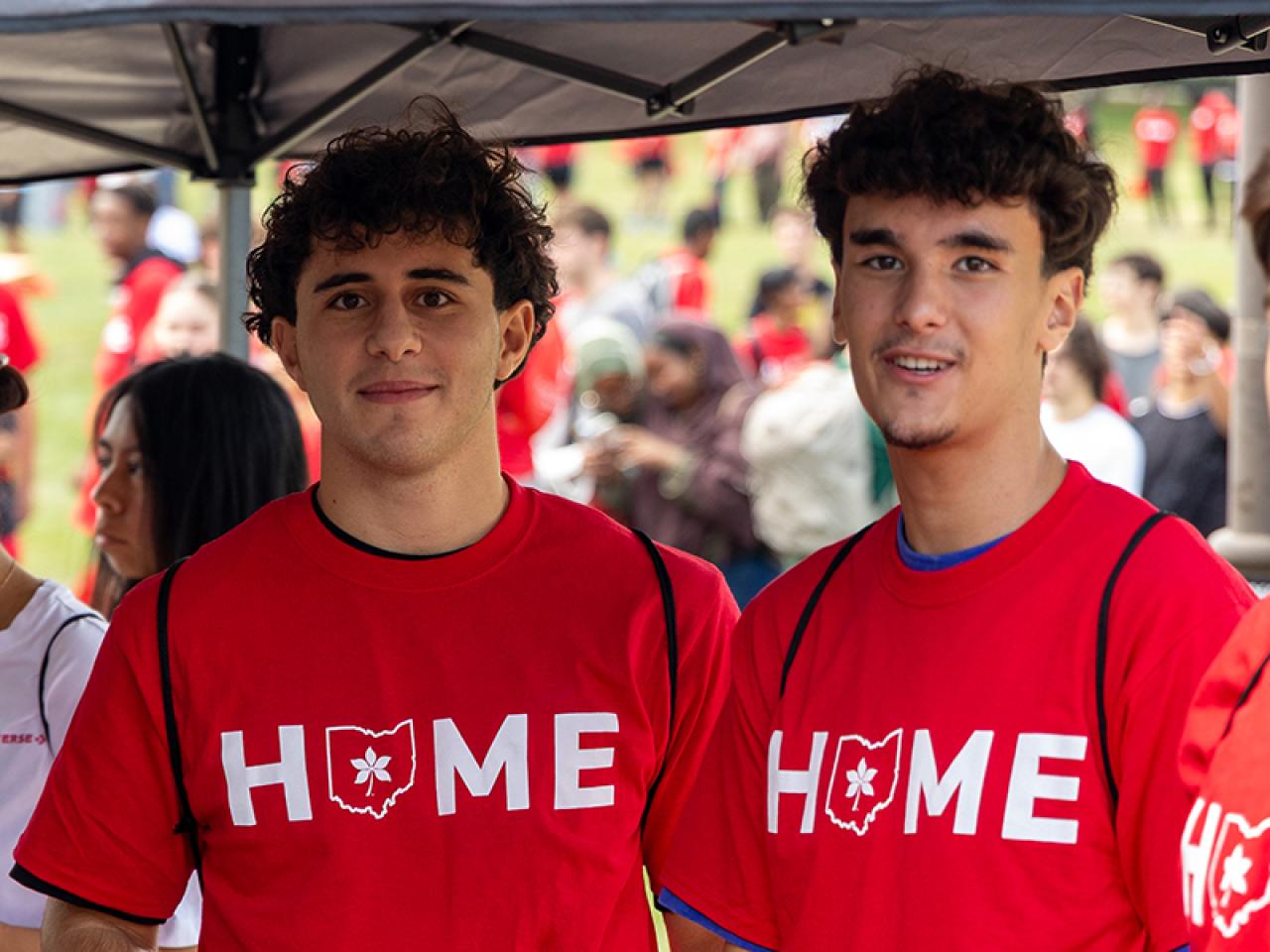 Two students on campus following Convocation.