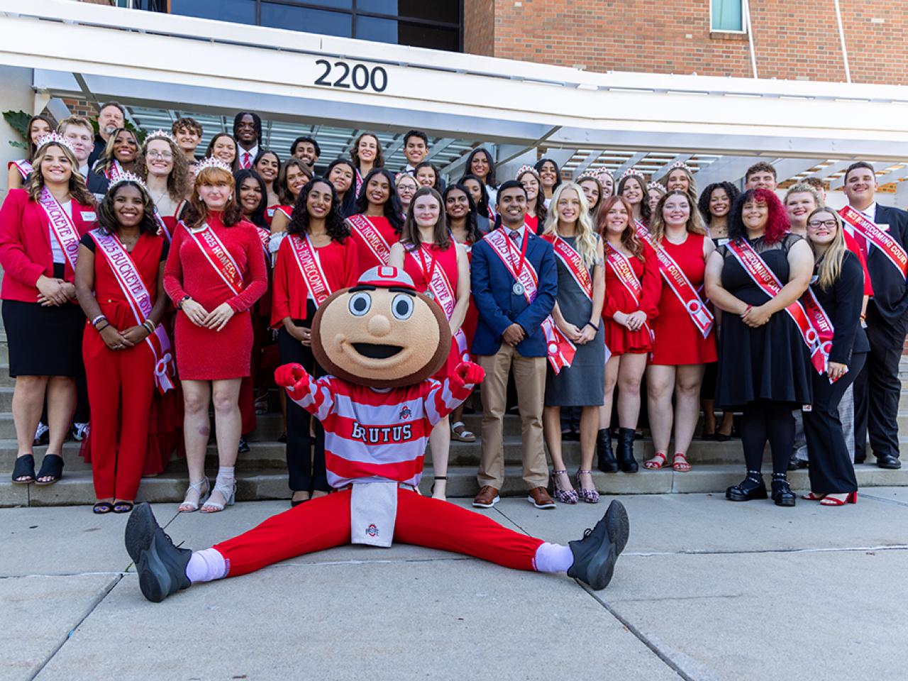 Ohio State regional campus Homecoming Court members with Brutus Buckeye outside the Longaberger Alumni House for the regional campus Homecoming recognition ceremony.