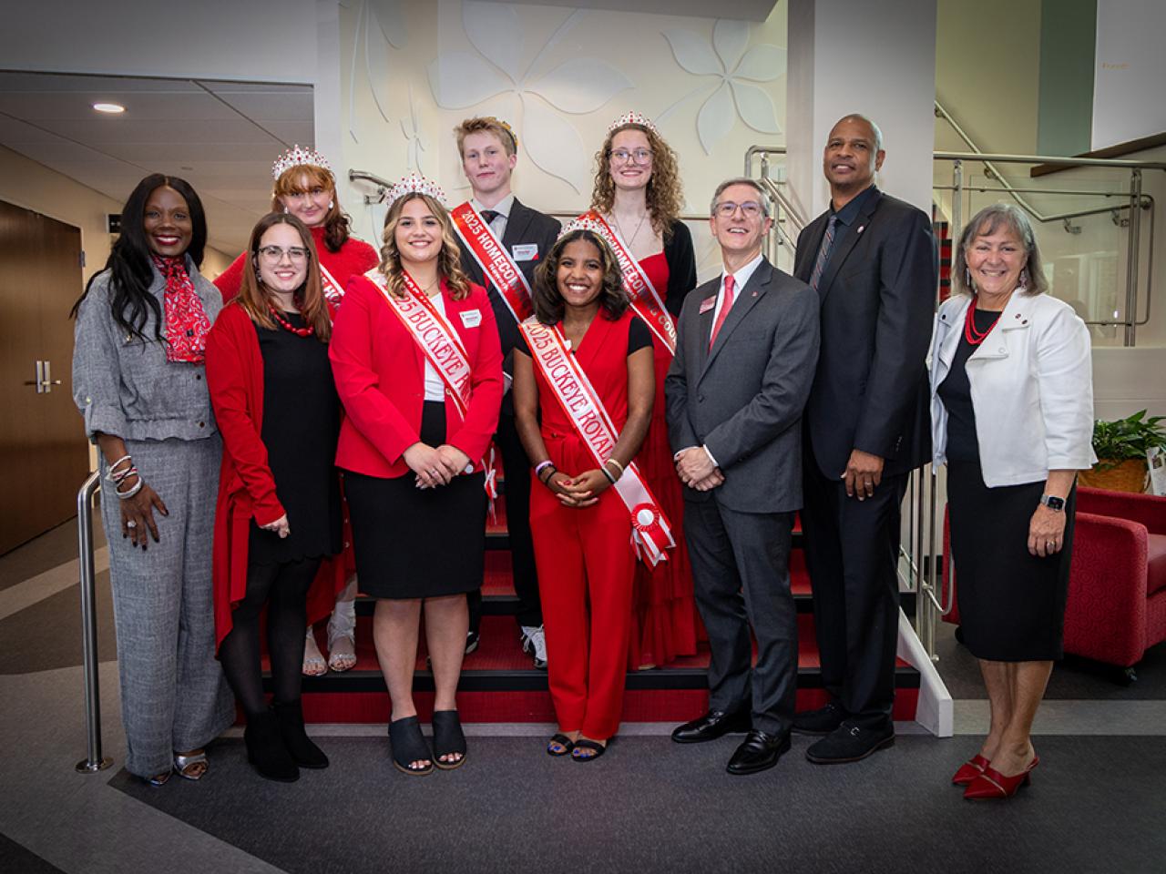 Ohio State Newark Homecoming Court members with campus leaders at the Longaberger Alumni House for the regional campus Homecoming recognition ceremony.