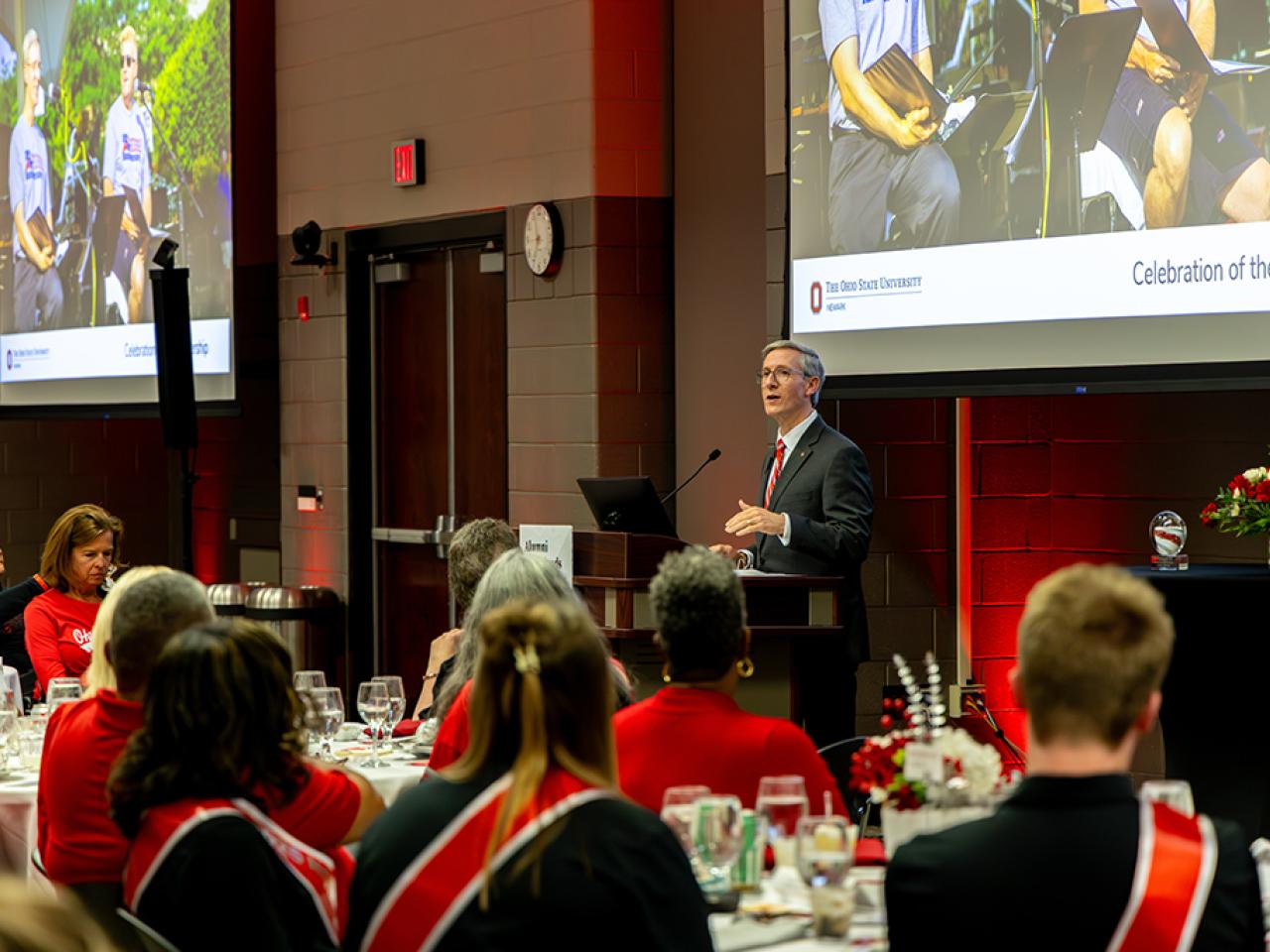 Dean and Director Matt Smith addresses the crowd from the podium.