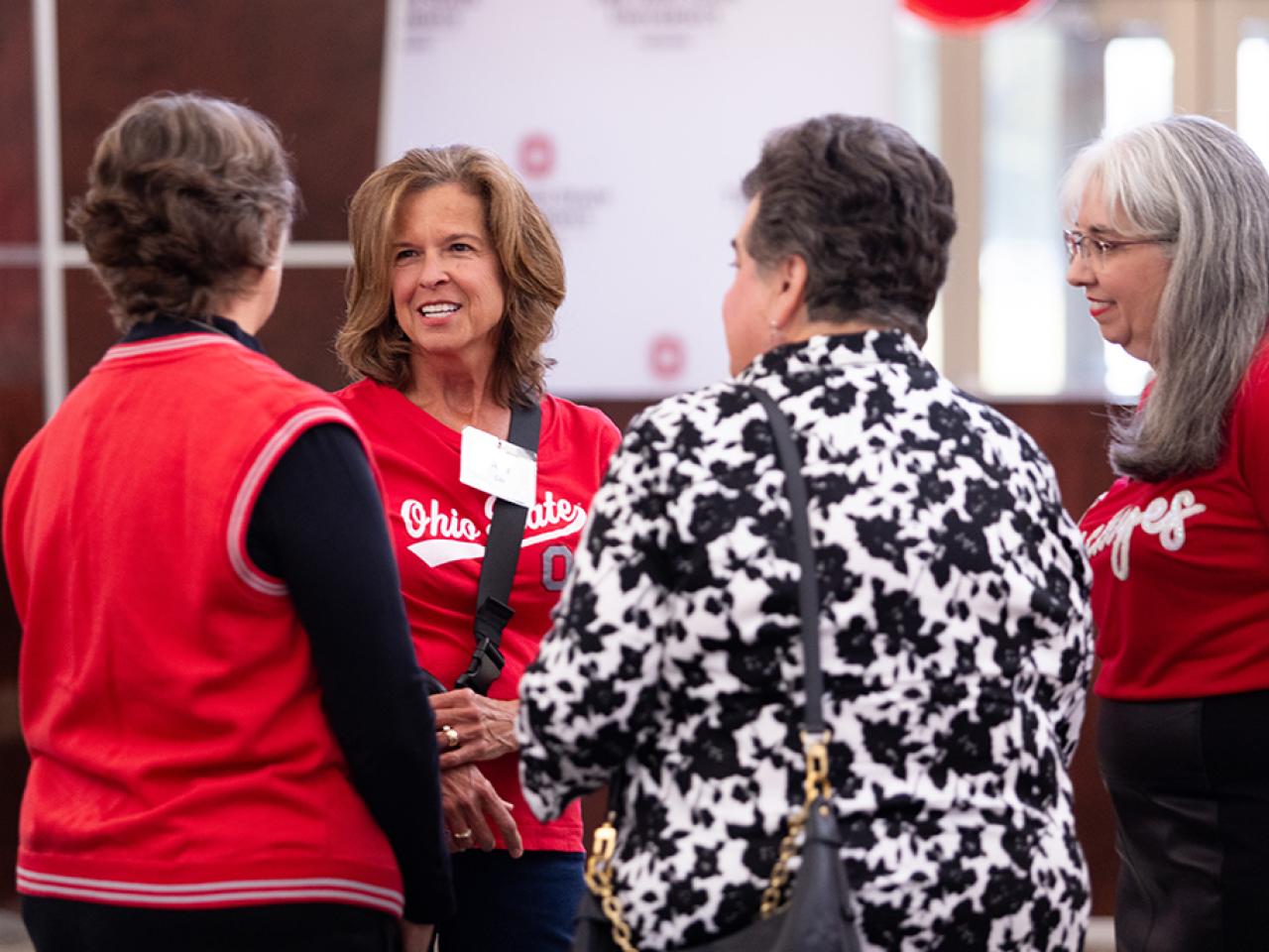 Guests converse during the alumni Homecoming celebration in the Reese Center.