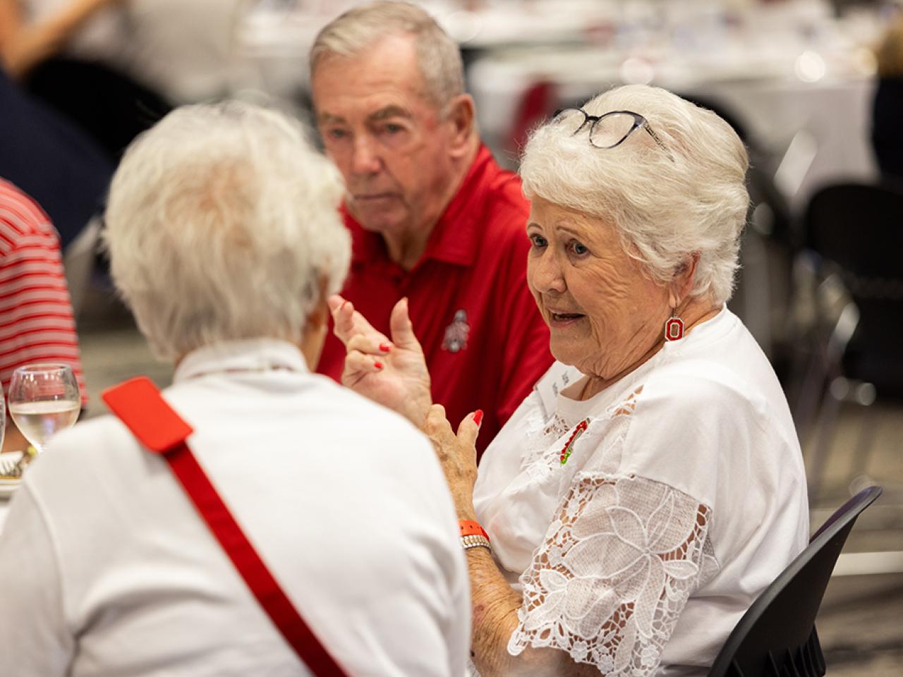 Guests converse during the alumni Homecoming celebration in the Reese Center.