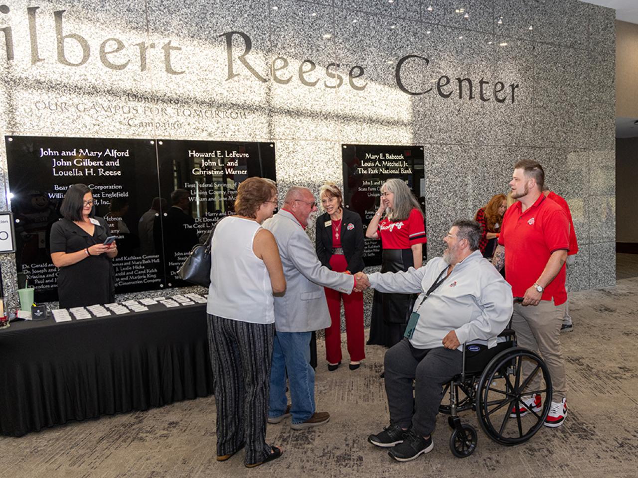 Guests converse during the alumni Homecoming celebration in the Reese Center.