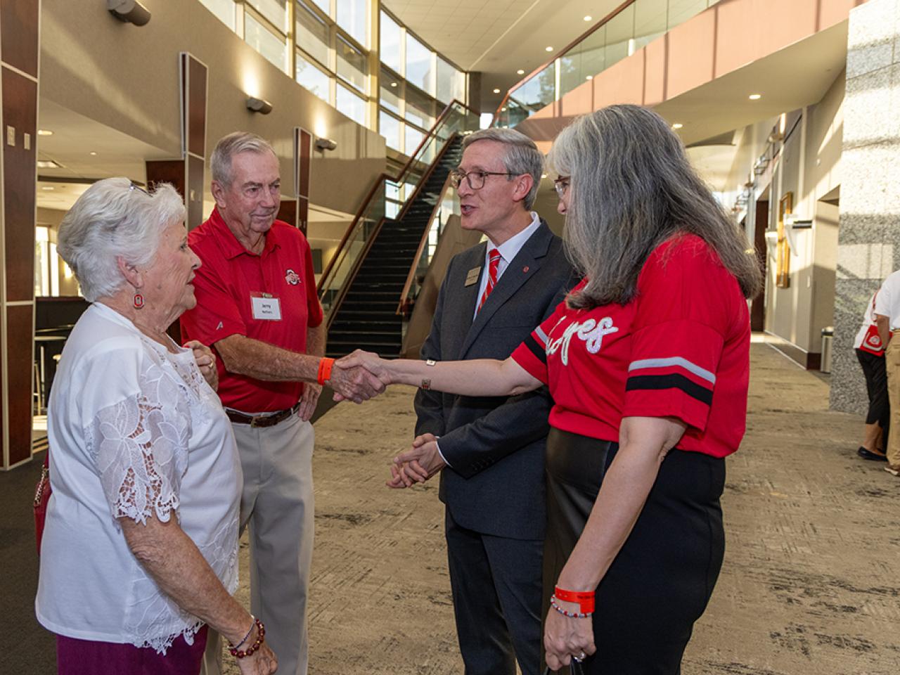 Guests speak to Dean and Director Matt Smith and his wife.