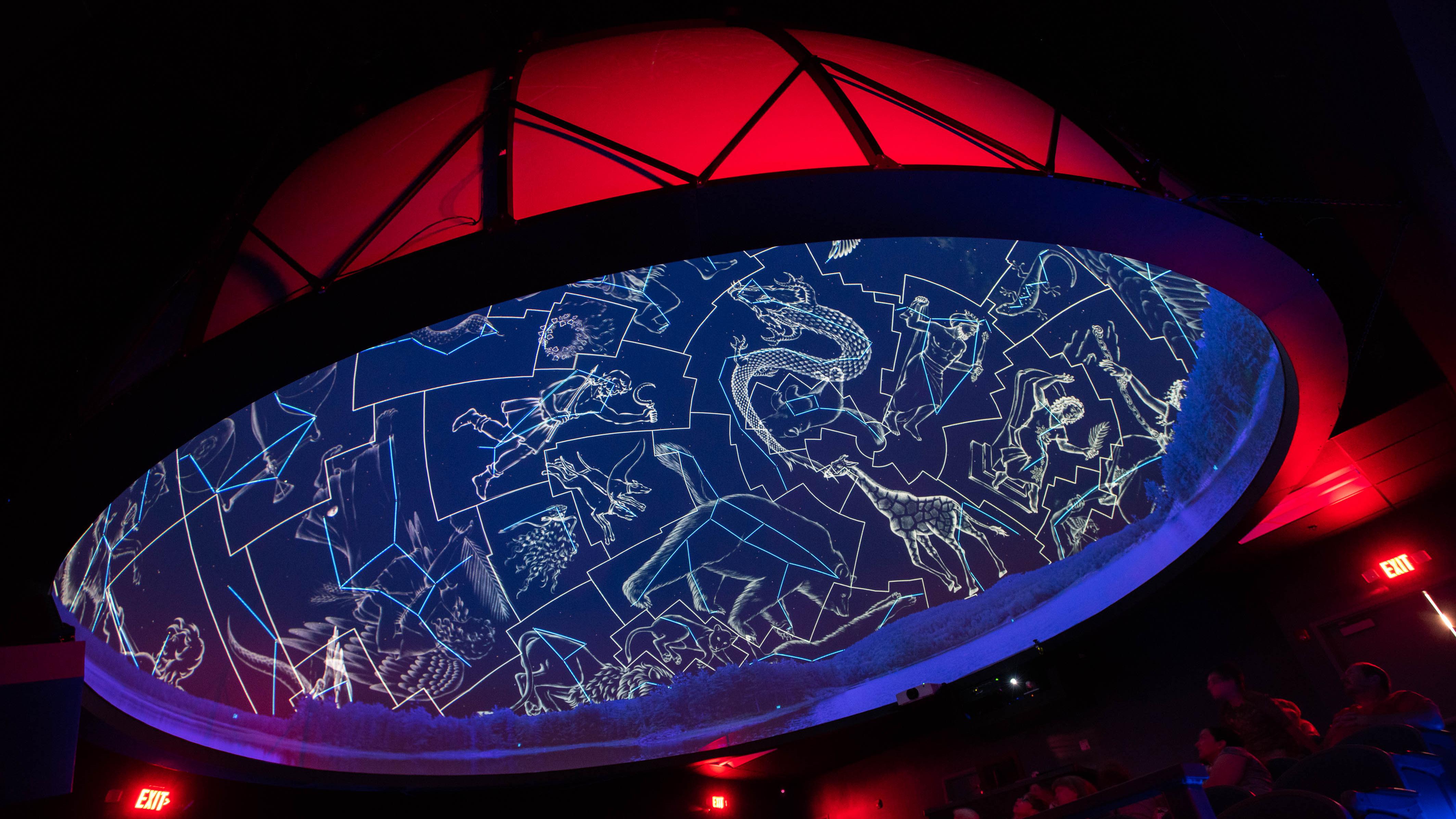 The dome of the SciDome planetarium is lit with constellations. 
