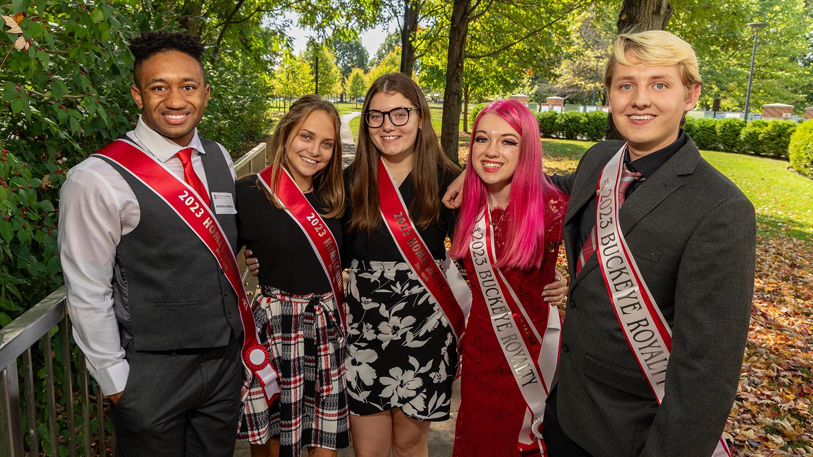 The Homecoming Court stands together outside for a photo. 