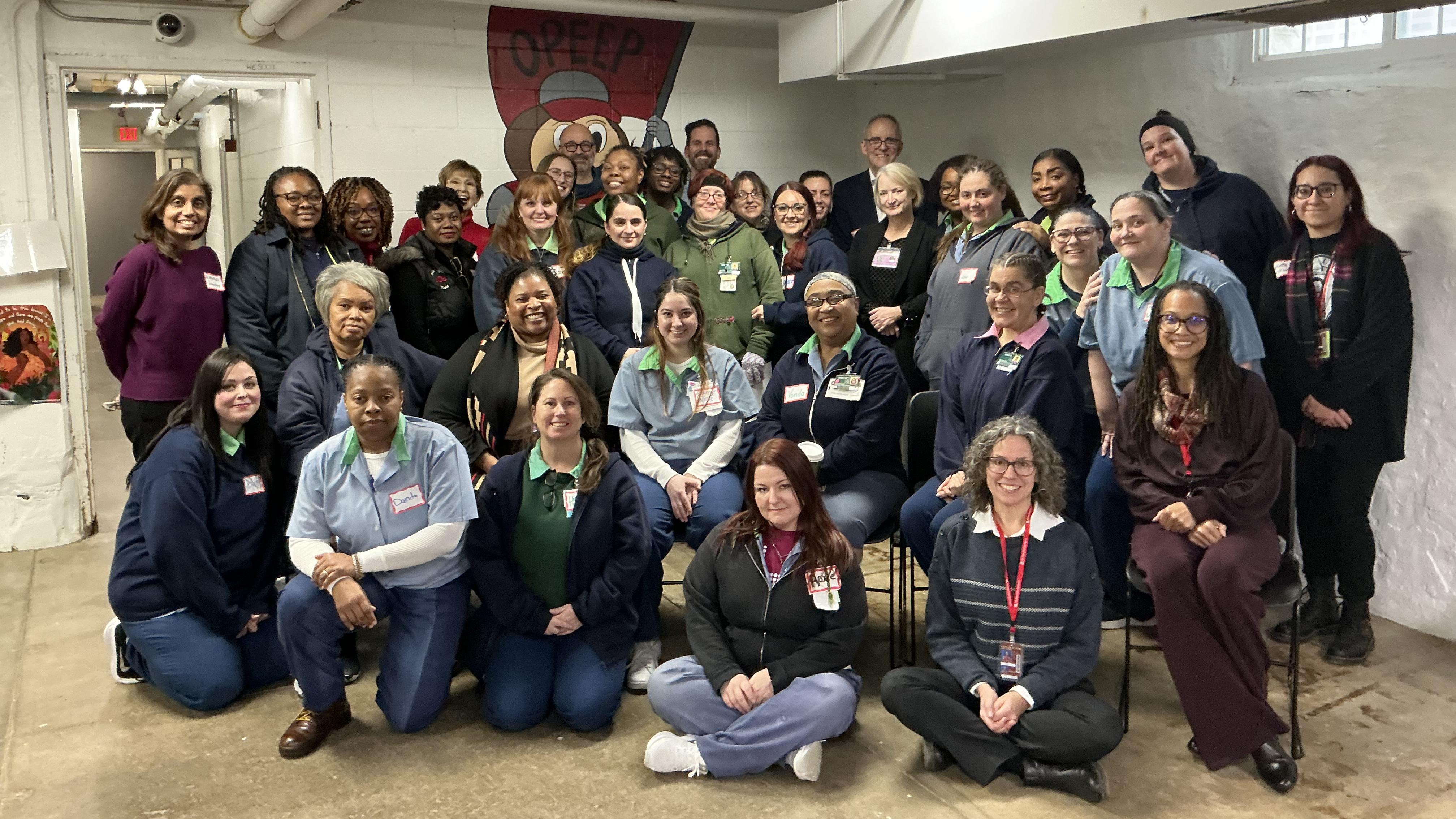 Ohio State faculty and students and incarcerated students at the Ohio Women's Reformatory gather in their basement classroom.