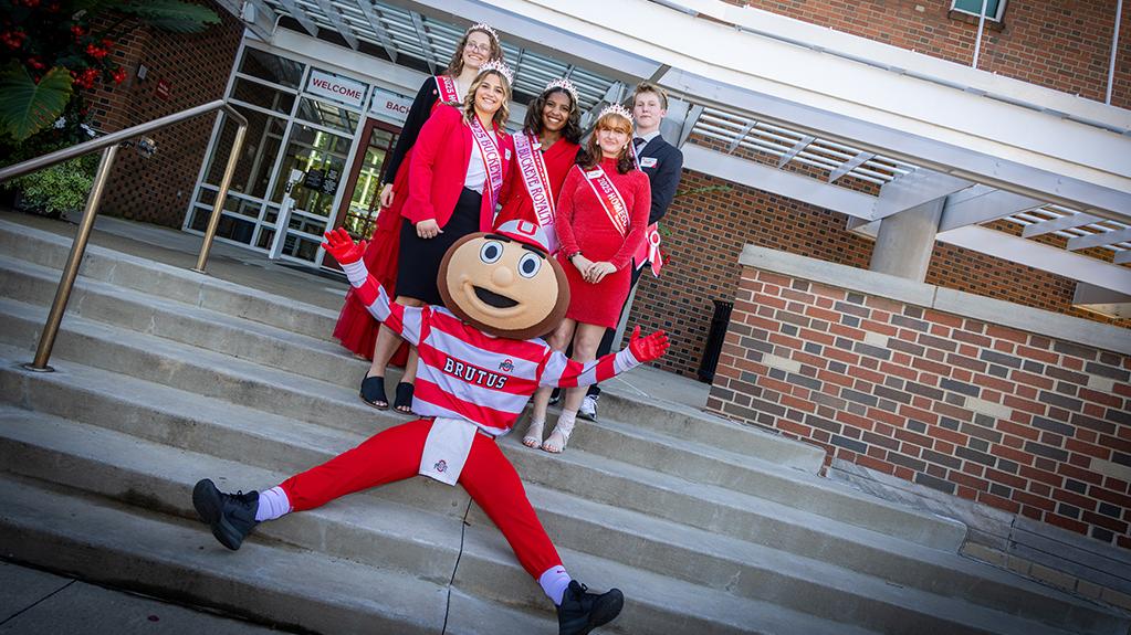 Ohio State Newark Homecoming Court members with Brutus Buckeye outside the Longaberger Alumni House for the regional campus Homecoming recognition ceremony.