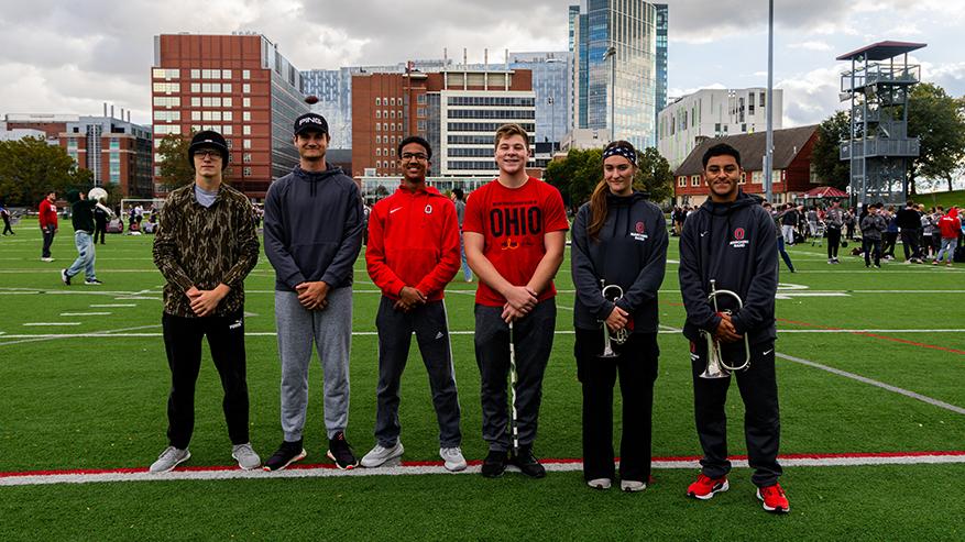 Ohio State marching band members that attend Ohio State Newark at the practice field in Columbus.