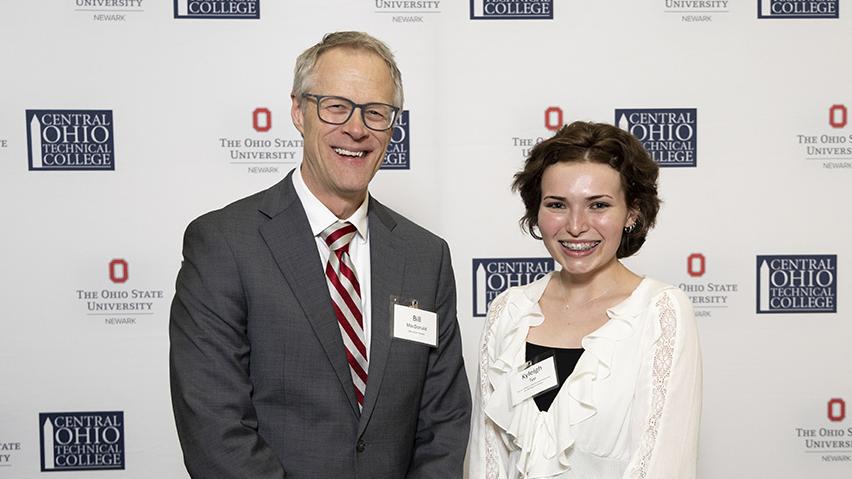Ohio State Newark student Kyleigh Tyo poses with former Ohio State Newark dean and director William MacDonald, PhD, after becoming the first recipient of a scholarship created in his honor. 