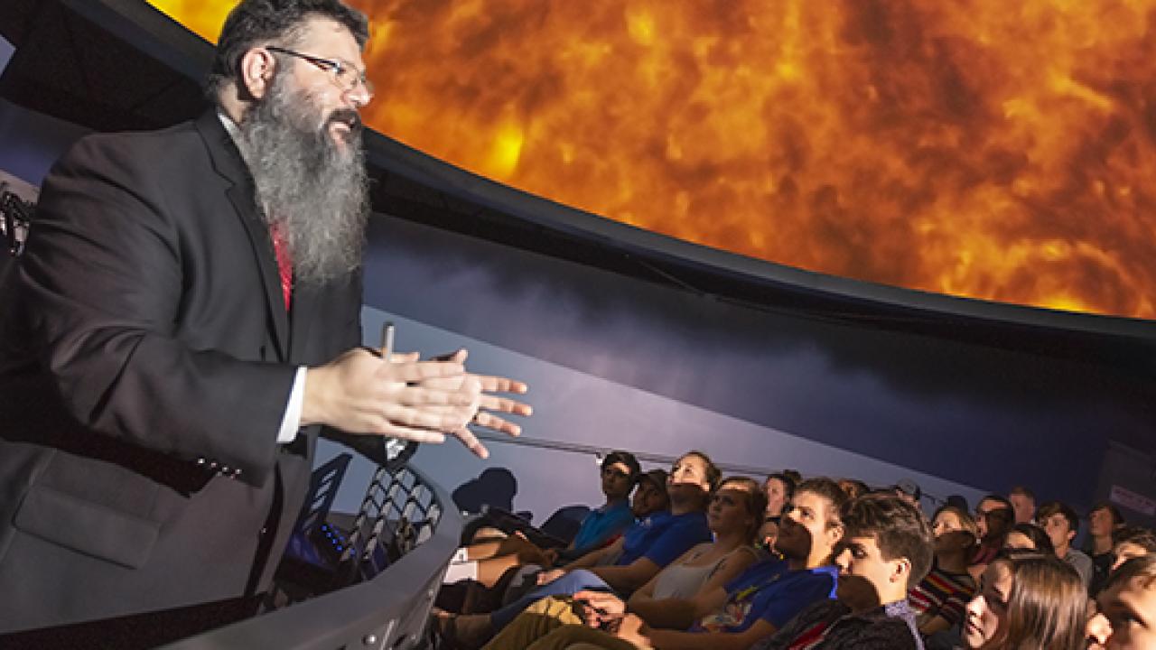 Lecturer speaking at SciDome