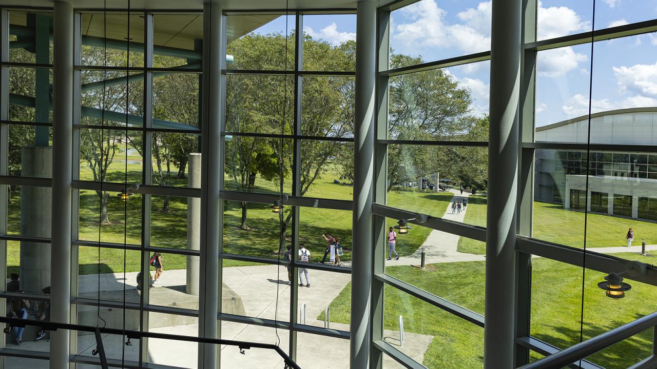 Looking through the windows of LeFevre Hall to the campus's interior quad.