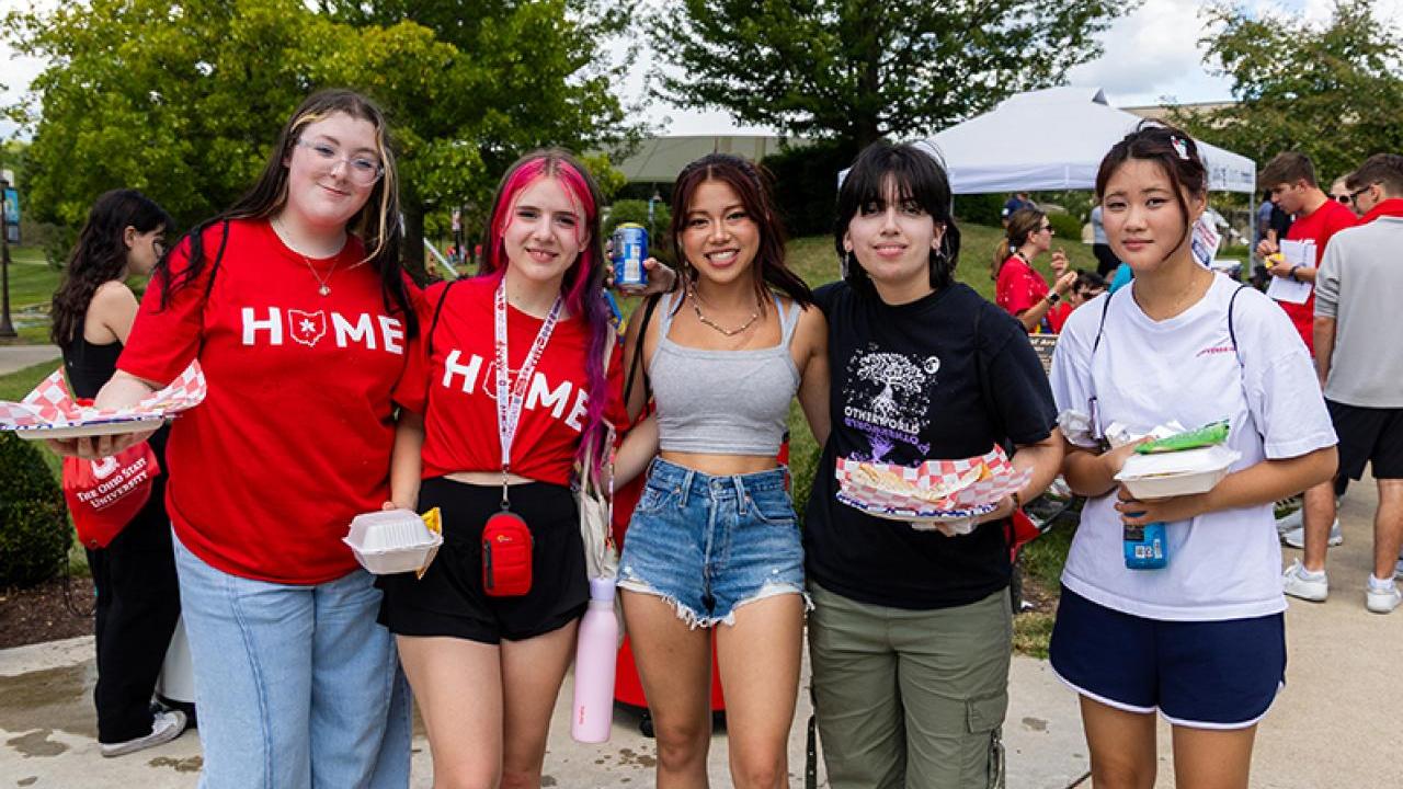 Group of OSU Newark students pose on campus following Convocation.