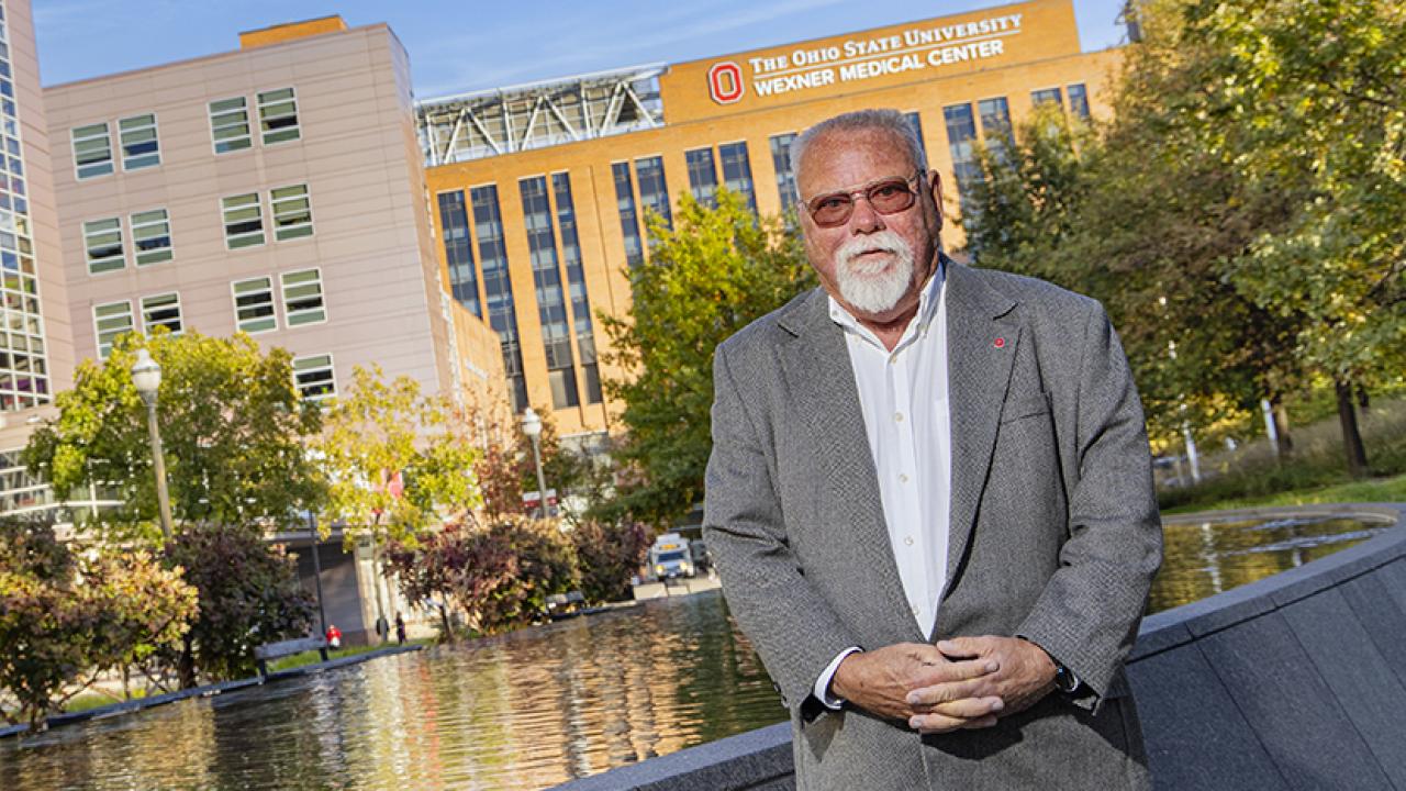 Portrait of Ken Yeager standing outside the Wexner Medical Center at The Ohio State University in Columbus.